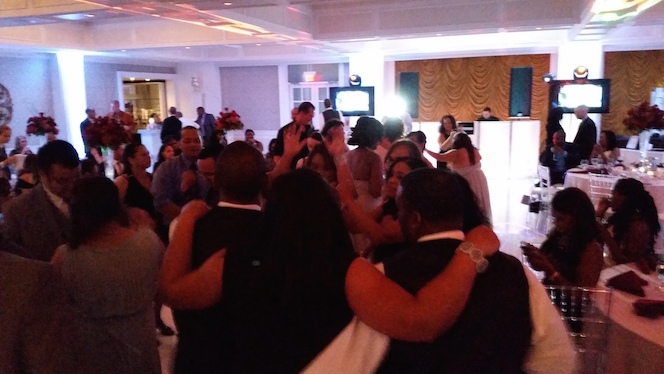 Lively Guests Pack the Dance Floor All Night Long in Honor of the Love Between These Newlyweds – Villa Venezia in Middletown, NY.